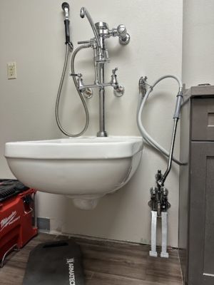 smart-plumbing-solutions-llc-0008 Wall-mounted bathroom sink with exposed chrome plumbing connections